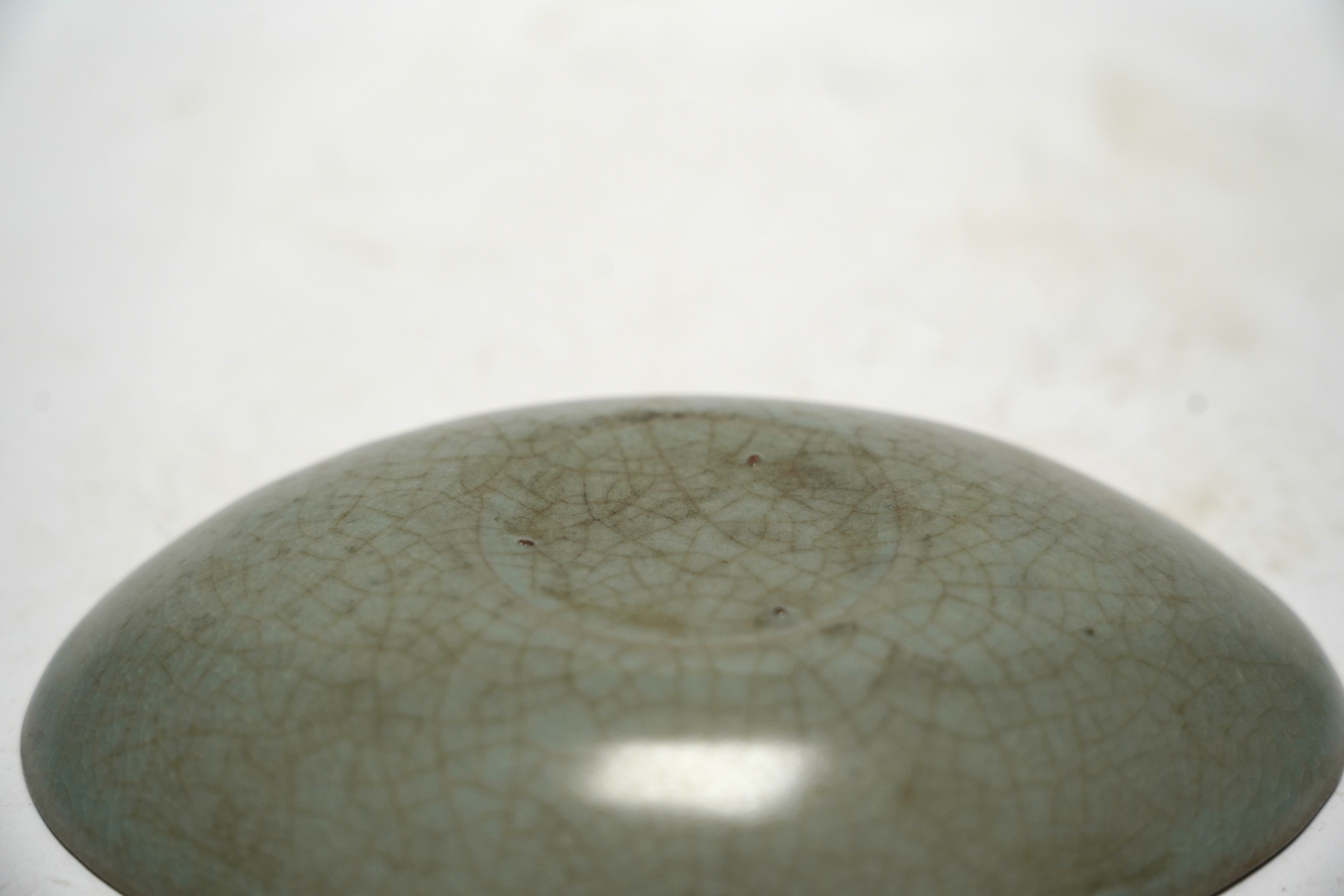 A Chinese oval celadon crackle glaze dish, 15.5cm wide